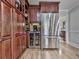 Elegant kitchen with stainless-steel appliances, a built-in wine fridge, and custom wood cabinetry at 750 Maggie Nw Ct, Kennesaw, GA 30144