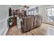 Cozy living room with fireplace, built-in shelves, comfortable seating, and hardwood floors at 750 Maggie Nw Ct, Kennesaw, GA 30144