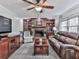 Cozy living room with brick fireplace, built-in bookcases, plush seating, and natural light at 750 Maggie Nw Ct, Kennesaw, GA 30144