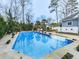 Refreshing pool with pristine water, framed by landscaped surroundings and a cozy patio, offering a serene outdoor retreat at 750 Maggie Nw Ct, Kennesaw, GA 30144