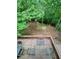 Spacious back deck overlooking a landscaped backyard with fire pit and American flag at 802 Eagle Glen Xing, Woodstock, GA 30189