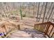 Stairs leading to secluded backyard with creek and flag pole at 802 Eagle Glen Xing, Woodstock, GA 30189