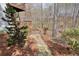 Backyard with stone path leading to stairs to private yard at 802 Eagle Glen Xing, Woodstock, GA 30189