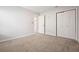 Bedroom with neutral carpet, fresh paint, closet and entry door offers a modern feel at 802 Eagle Glen Xing, Woodstock, GA 30189
