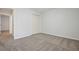 A light-filled carpeted bedroom with closet at 802 Eagle Glen Xing, Woodstock, GA 30189