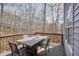 Outdoor deck with wood railings is perfect for entertaining or relaxing with a view at 802 Eagle Glen Xing, Woodstock, GA 30189