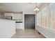 Bright dining area with view to kitchen and backyard through large windows at 802 Eagle Glen Xing, Woodstock, GA 30189