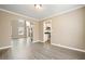 Open dining space flows into the living area, next to a modern kitchen, with natural light at 802 Eagle Glen Xing, Woodstock, GA 30189