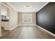 Cozy dining room with neutral paint and hardwood floors, perfect for Gathering meals at 802 Eagle Glen Xing, Woodstock, GA 30189