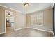 Bright dining room with hardwood floors leading to the kitchen, perfect for Gathering gatherings at 802 Eagle Glen Xing, Woodstock, GA 30189