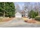 Charming home with a two car garage, well-maintained lawn, and mature trees at 802 Eagle Glen Xing, Woodstock, GA 30189