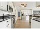 Modern kitchen featuring stainless steel appliances, granite countertops, and plenty of cabinet space at 802 Eagle Glen Xing, Woodstock, GA 30189