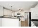 Kitchen boasts stainless steel appliances, granite countertops, and a breakfast bar at 802 Eagle Glen Xing, Woodstock, GA 30189