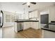 Bright kitchen features stainless steel appliances, granite countertops, and modern lighting at 802 Eagle Glen Xing, Woodstock, GA 30189