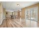 Spacious living room with hardwood floors, sliding glass doors and neutral colored paint at 802 Eagle Glen Xing, Woodstock, GA 30189