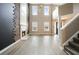 Inviting living room boasting high ceilings, statement fireplace, hardwood floors, and staircase at 802 Eagle Glen Xing, Woodstock, GA 30189