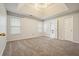 Spacious bedroom features tray ceilings, recessed lights, and ensuite bathroom at 802 Eagle Glen Xing, Woodstock, GA 30189