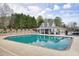 Refreshing community pool with a covered patio perfect for lounging and entertaining on sunny days at 802 Eagle Glen Xing, Woodstock, GA 30189