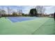 Well-maintained tennis courts with green and blue surfaces for sports and recreation within the community at 802 Eagle Glen Xing, Woodstock, GA 30189