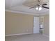 Bedroom featuring neutral walls and trim, carpeted floor, and a white door at 1211 Saxony Se Dr, Conyers, GA 30013