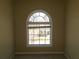 Cozy bedroom with a unique arched window, perfect for a tranquil retreat at 1211 Saxony Se Dr, Conyers, GA 30013
