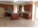 Modern kitchen with stainless steel appliances, tile backsplash, and a functional center island at 1211 Saxony Se Dr, Conyers, GA 30013