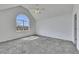 Large bedroom features vaulted ceiling, dormer window, carpet, and white paint at 16 Montclair Ct, Cartersville, GA 30121