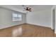 Spacious bedroom with wood laminate flooring and large window allowing natural light at 16 Montclair Ct, Cartersville, GA 30121