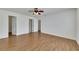 Large primary bedroom features wood laminate flooring, a ceiling fan, and two closets at 16 Montclair Ct, Cartersville, GA 30121
