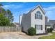 Side angle of a gray two-story home with fresh landscaping, driveway and privacy fence at 16 Montclair Ct, Cartersville, GA 30121