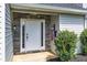 Welcoming front entrance with decorative stonework and outdoor lanterns, plus colorful decor at 16 Montclair Ct, Cartersville, GA 30121