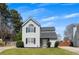Charming two-story home featuring a well-maintained lawn, gray siding, and a freshly sealed driveway at 16 Montclair Ct, Cartersville, GA 30121