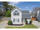 Beautiful two-story home featuring fresh landscaping, gray siding, and a freshly sealed driveway at 16 Montclair Ct, Cartersville, GA 30121