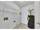A simple laundry area features wire shelving, water heater, and hookups for a washer and dryer at 16 Montclair Ct, Cartersville, GA 30121