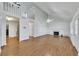 Bright living room with high ceilings, wood floors, fireplace, and an open staircase at 16 Montclair Ct, Cartersville, GA 30121