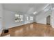 Bright living room with high ceilings, wood floors, fireplace and an open staircase at 16 Montclair Ct, Cartersville, GA 30121