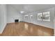 Spacious living room featuring wood floors, a cozy fireplace, and ample natural light at 16 Montclair Ct, Cartersville, GA 30121