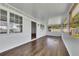 Screened-in porch features hardwood flooring and ample light at 16 Montclair Ct, Cartersville, GA 30121