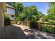 Spacious wood deck overlooks a lush green backyard and features a stained wood railing at 2628 White Oak Dr, Decatur, GA 30032