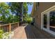 Spacious wood deck overlooks a lush green backyard and features a stained wood railing at 2628 White Oak Dr, Decatur, GA 30032