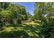 Expansive back yard enclosed by a wooden fence offering plenty of space for outdoor activities at 2628 White Oak Dr, Decatur, GA 30032