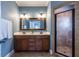 Modern bathroom features a double sink vanity and a glass-enclosed tiled shower at 2628 White Oak Dr, Decatur, GA 30032