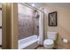 Bathroom featuring shower and tub combination and neutral accents at 2628 White Oak Dr, Decatur, GA 30032