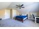 Bedroom features a sloped ceiling, two closets, and a comfortable bed with blue bedding at 2628 White Oak Dr, Decatur, GA 30032