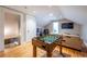 Cozy bonus room with a foosball table and a comfortable sitting area with a television at 2628 White Oak Dr, Decatur, GA 30032