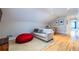 Cozy bonus room with a foosball table and a comfortable sitting area with a red beanbag at 2628 White Oak Dr, Decatur, GA 30032