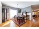 Charming dining room with wood floors, six-seat table, and adjacent living area at 2628 White Oak Dr, Decatur, GA 30032