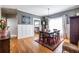 Inviting dining area open to kitchen, featuring hardwood floors and a six seat dining table at 2628 White Oak Dr, Decatur, GA 30032