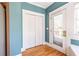 Mudroom features white bi-fold doors with wood floors and neutral walls at 2628 White Oak Dr, Decatur, GA 30032
