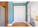 Mudroom features white bi-fold doors with wood floors and neutral walls at 2628 White Oak Dr, Decatur, GA 30032